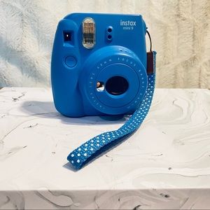 Blue Instax polaroid camera